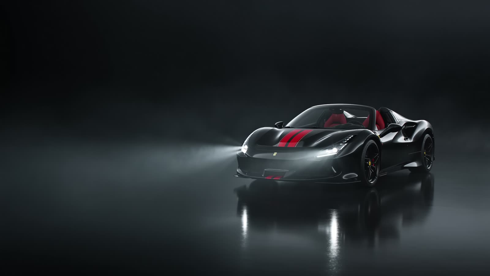 Black 2023 Ferrari F8 Spyder in a dark studio